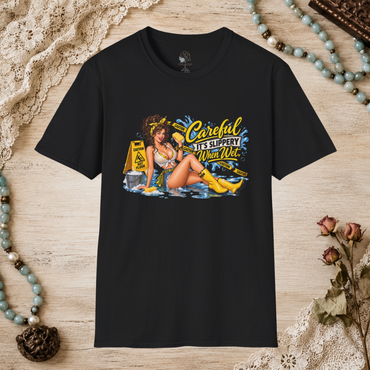 Black unisex T-shirt featuring the Careful It’s Slippery When Wet pin-up design