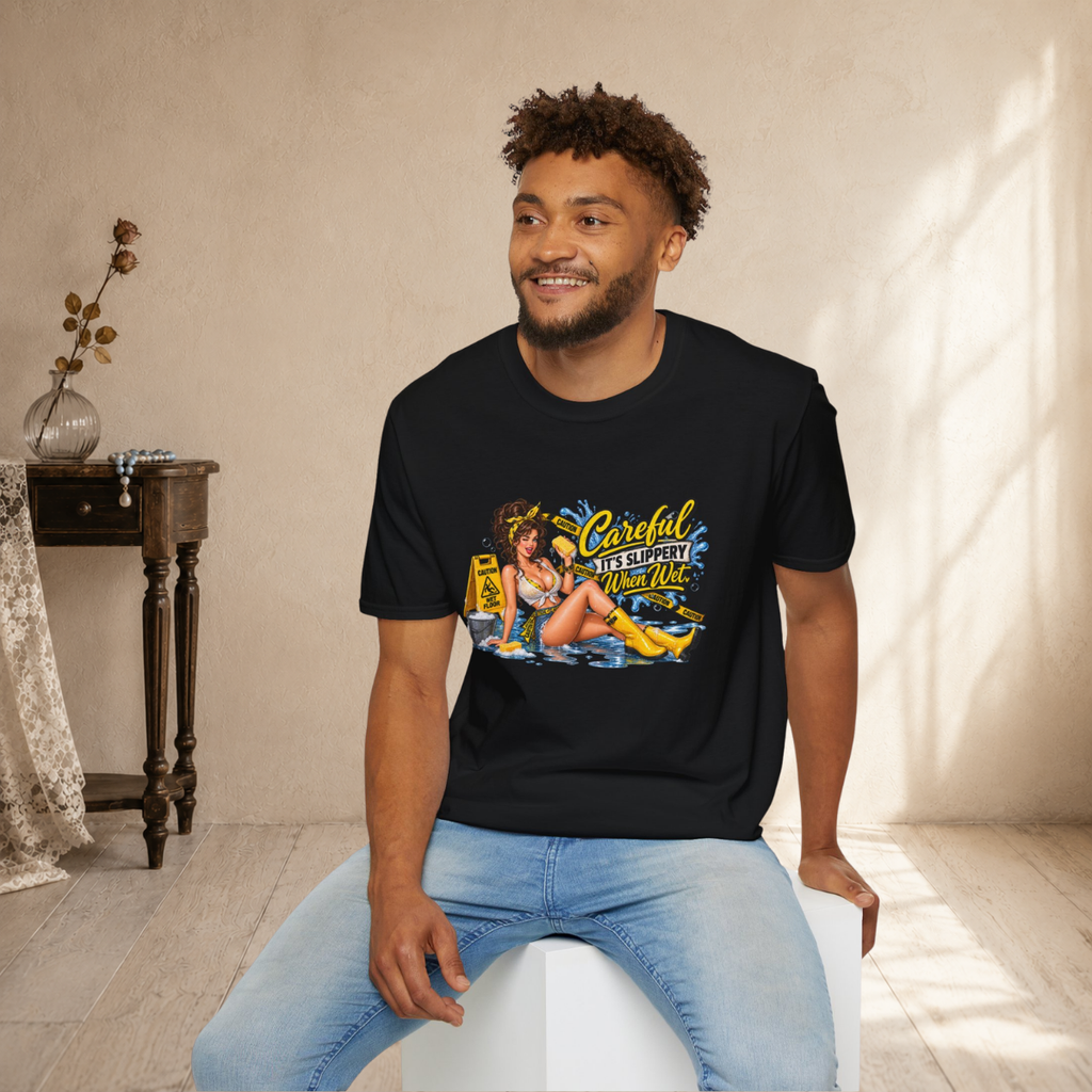 Seated male model wearing a dark heather grey Careful It’s Slippery When Wet pin-up T-shirt