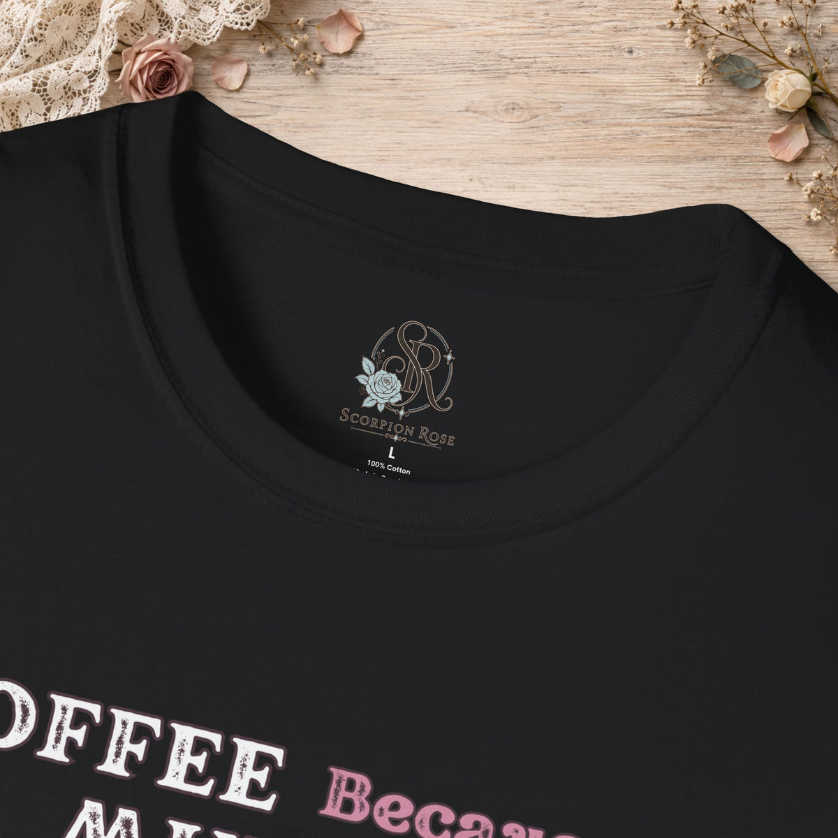 Close-up of the Black Coffee Because Murder Is Wrong T-shirt neckline and printed design