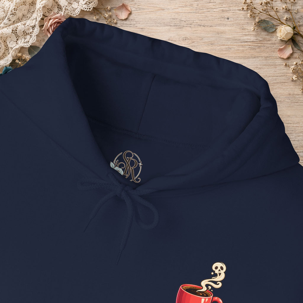 Close-up of the navy hoodie neckline and small red coffee cup front design