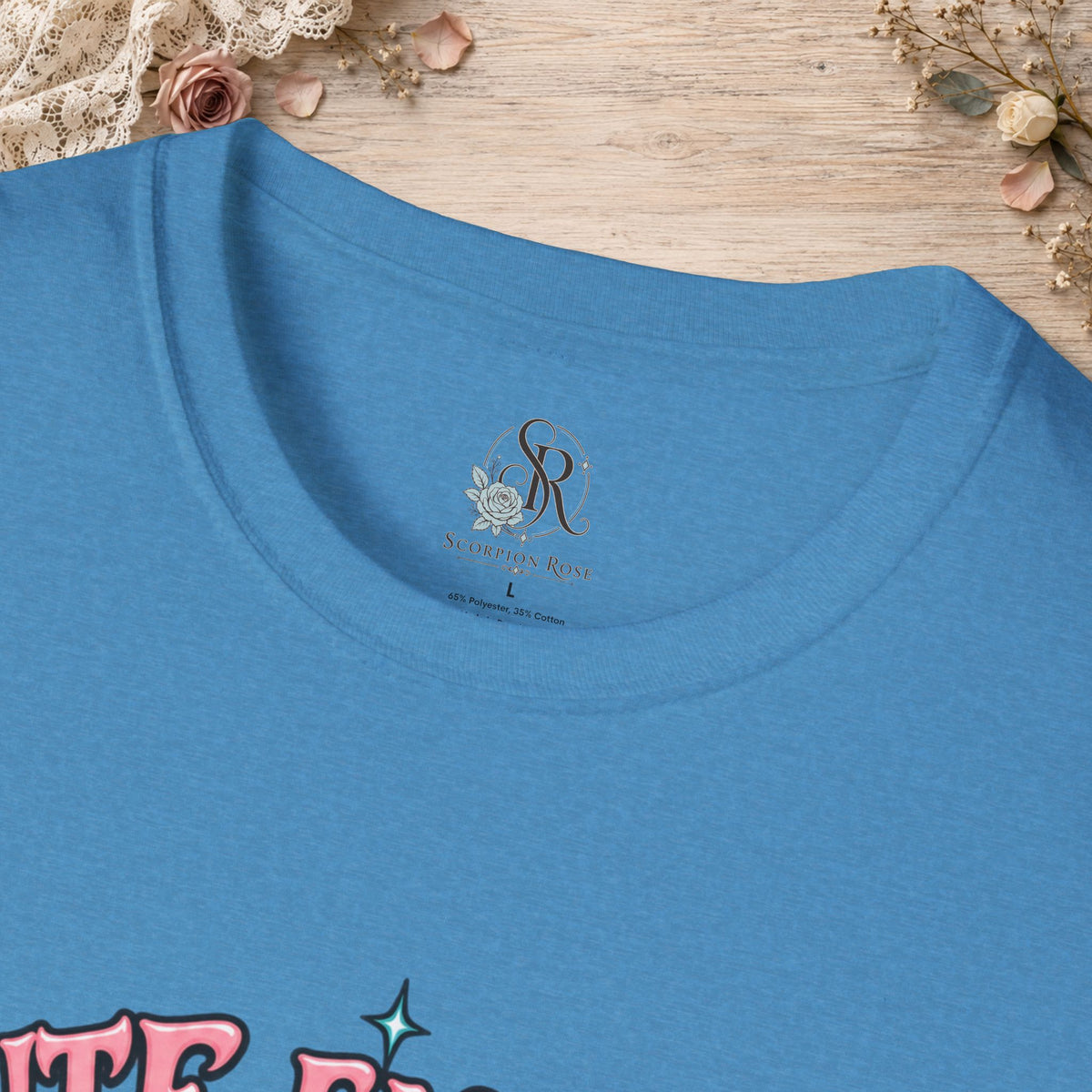 Collar and print detail of the Heather Sapphire Cute Enough to Get Away With It unisex T-shirt