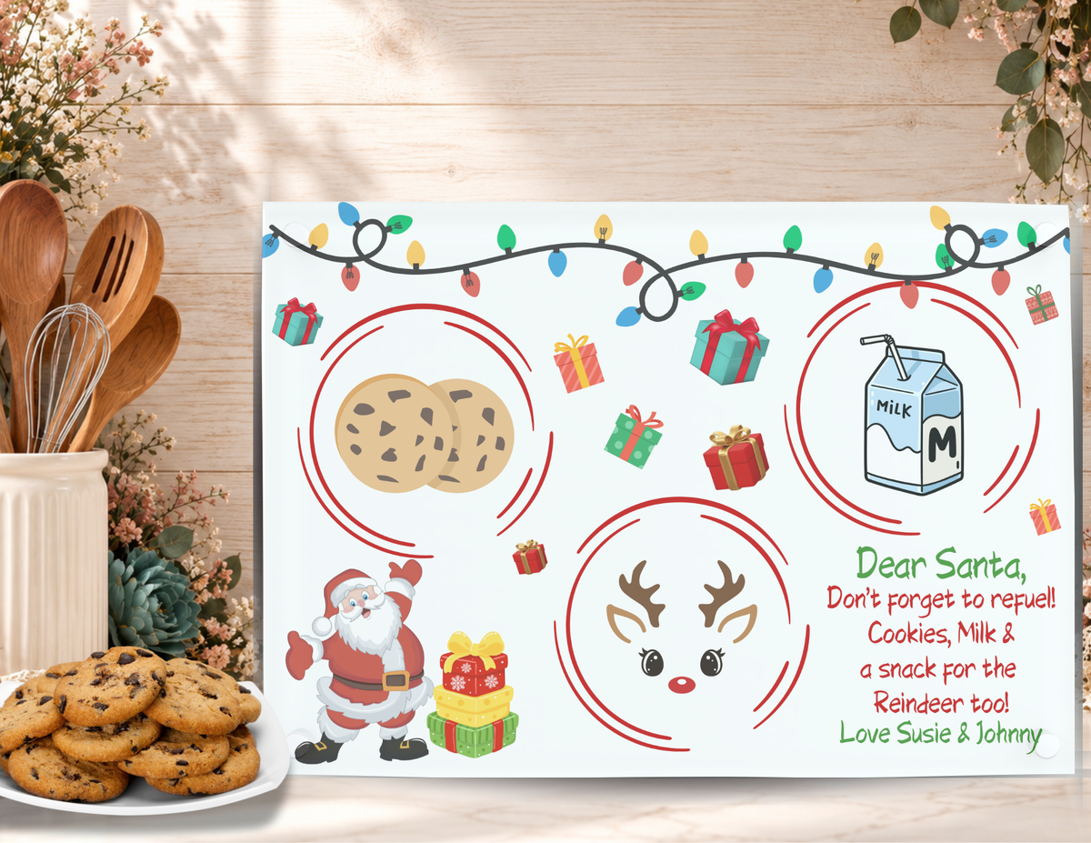 Personalized Santa Refuel cookie tray displayed beside chocolate chip cookies with sample names added beneath the Christmas message