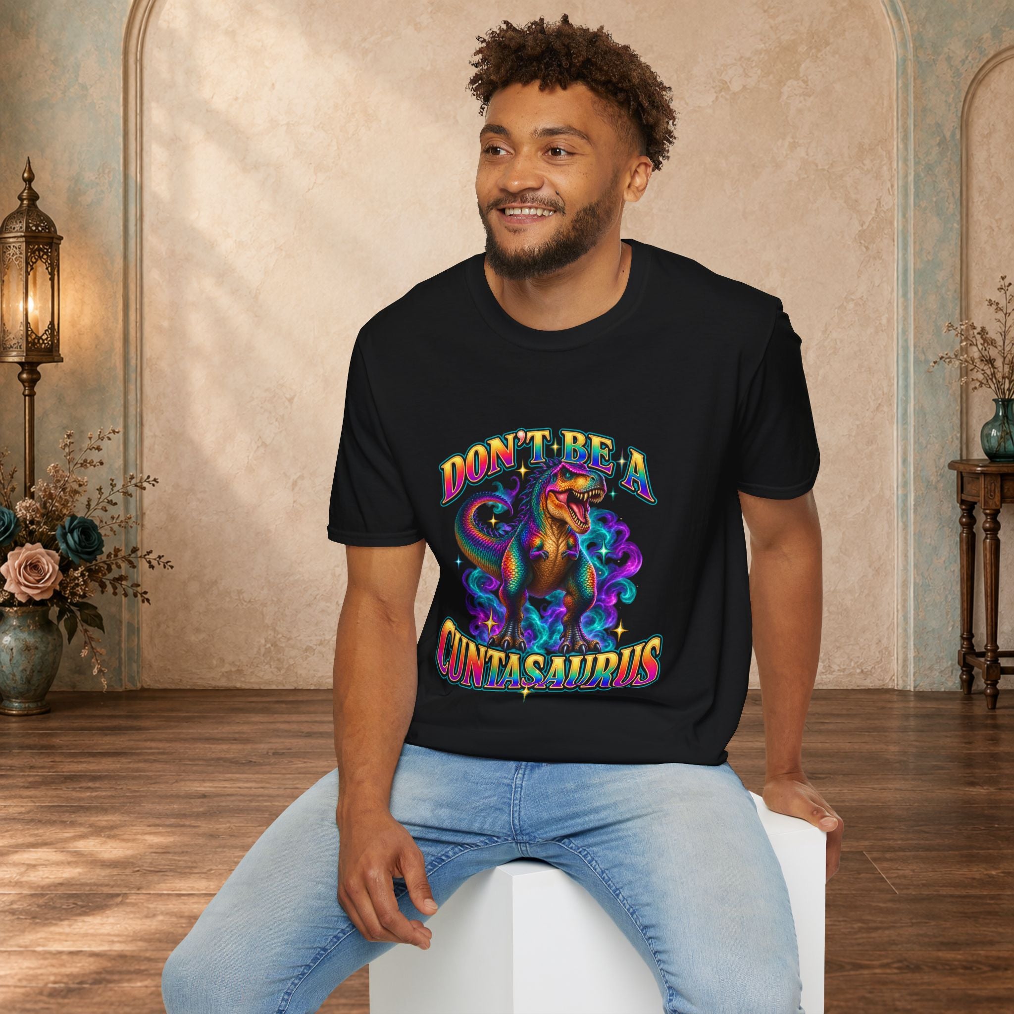 Man wearing a black Don’t Be a Cuntasaurus funny dinosaur graphic T-shirt