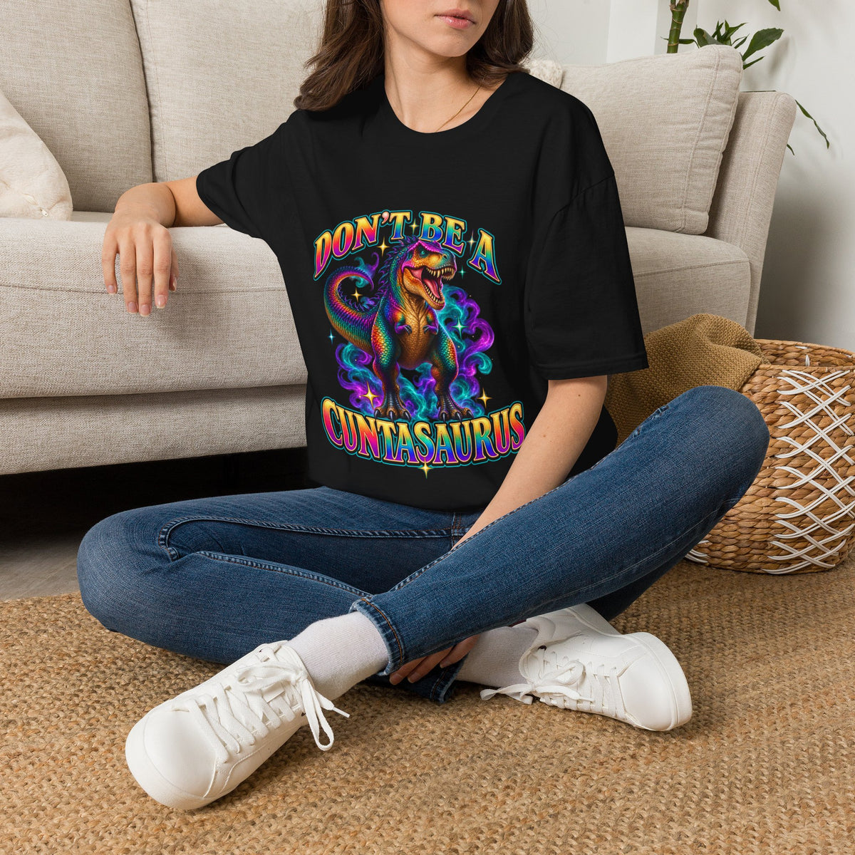 Woman wearing a black Don’t Be a Cuntasaurus funny dinosaur graphic T-shirt