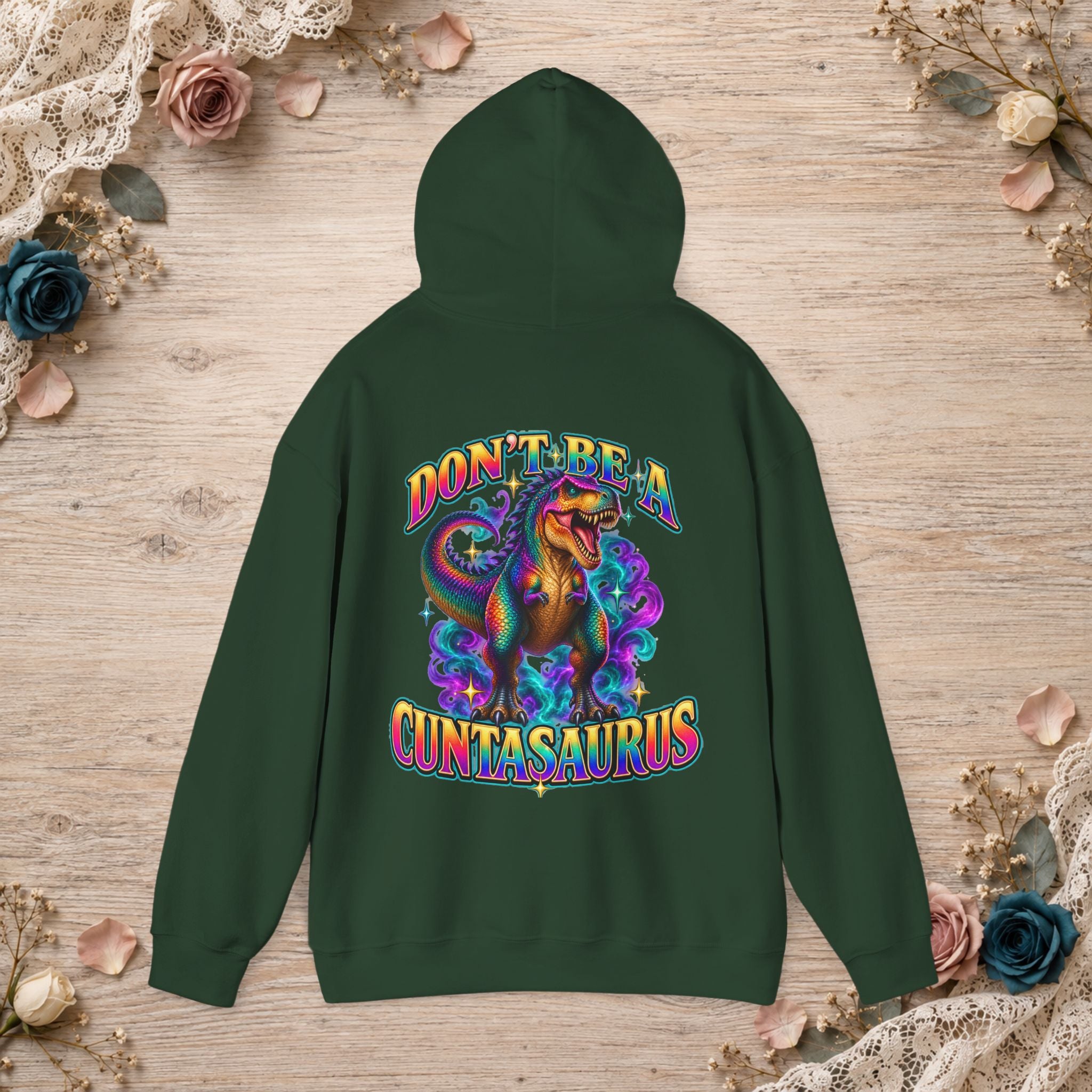 Forest green Don’t Be a Cuntasaurus hoodie with a colorful dinosaur back design