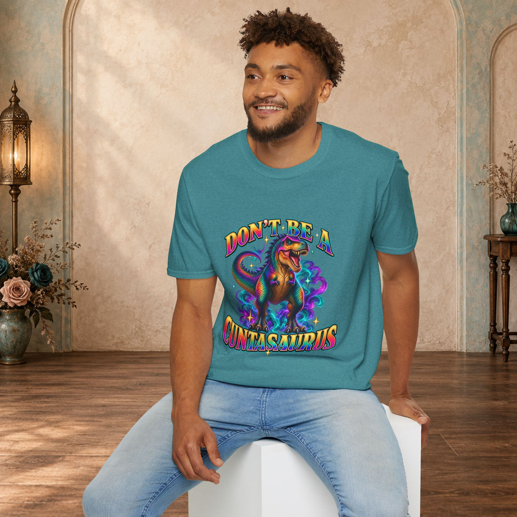 Man wearing a heather Galapagos blue Don’t Be a Cuntasaurus graphic T-shirt