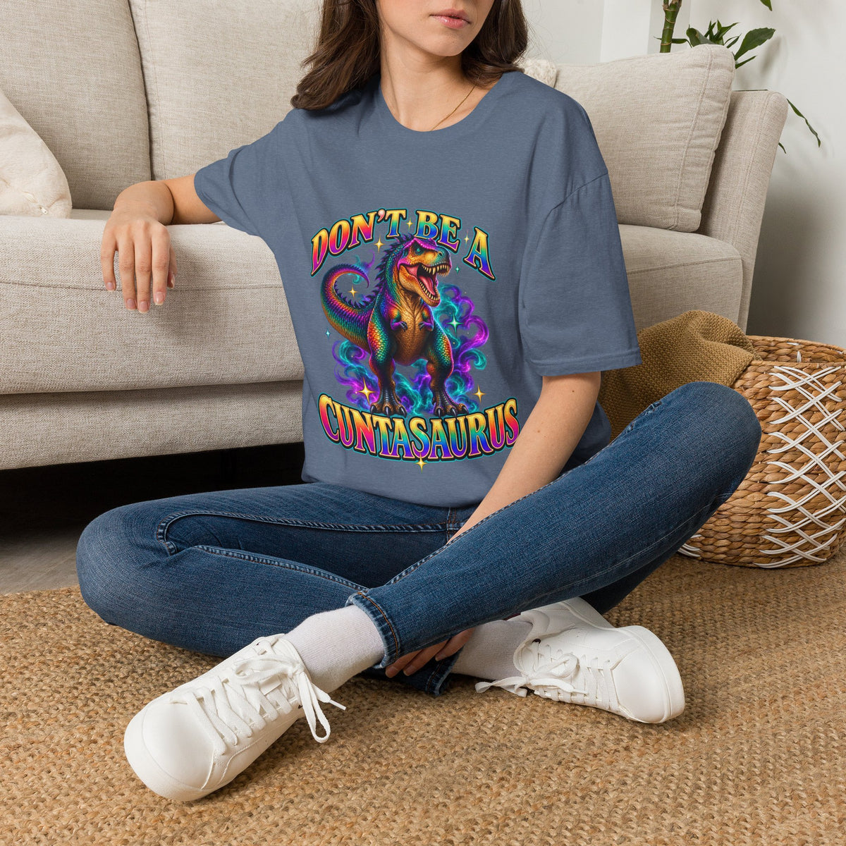 Woman wearing a heather indigo Don’t Be a Cuntasaurus adult humor graphic tee