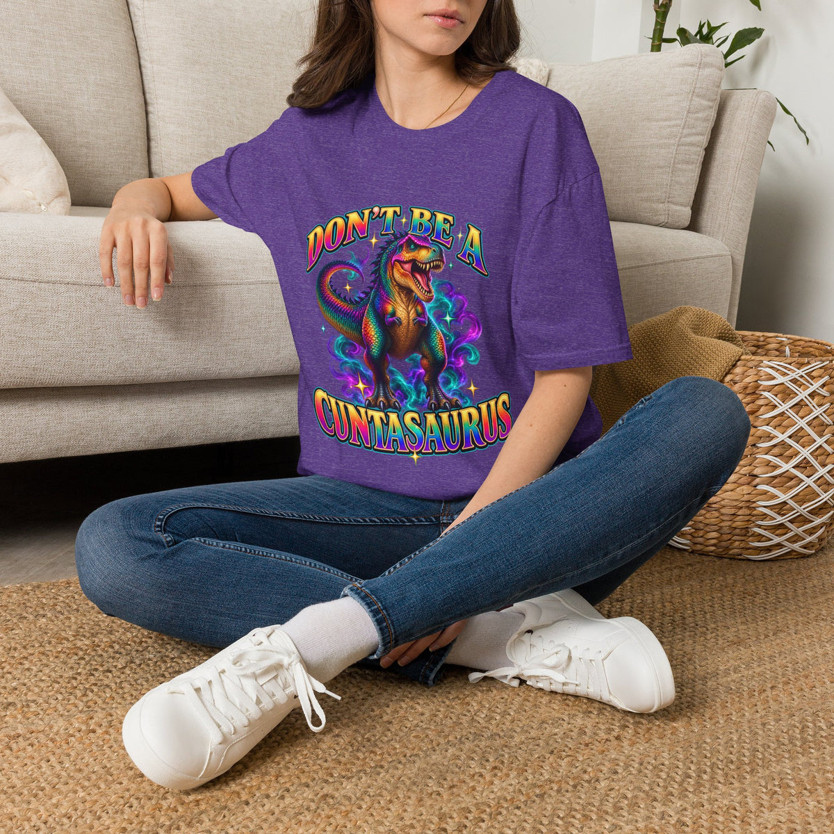 Woman wearing a heather purple Don’t Be a Cuntasaurus funny dinosaur T-shirt