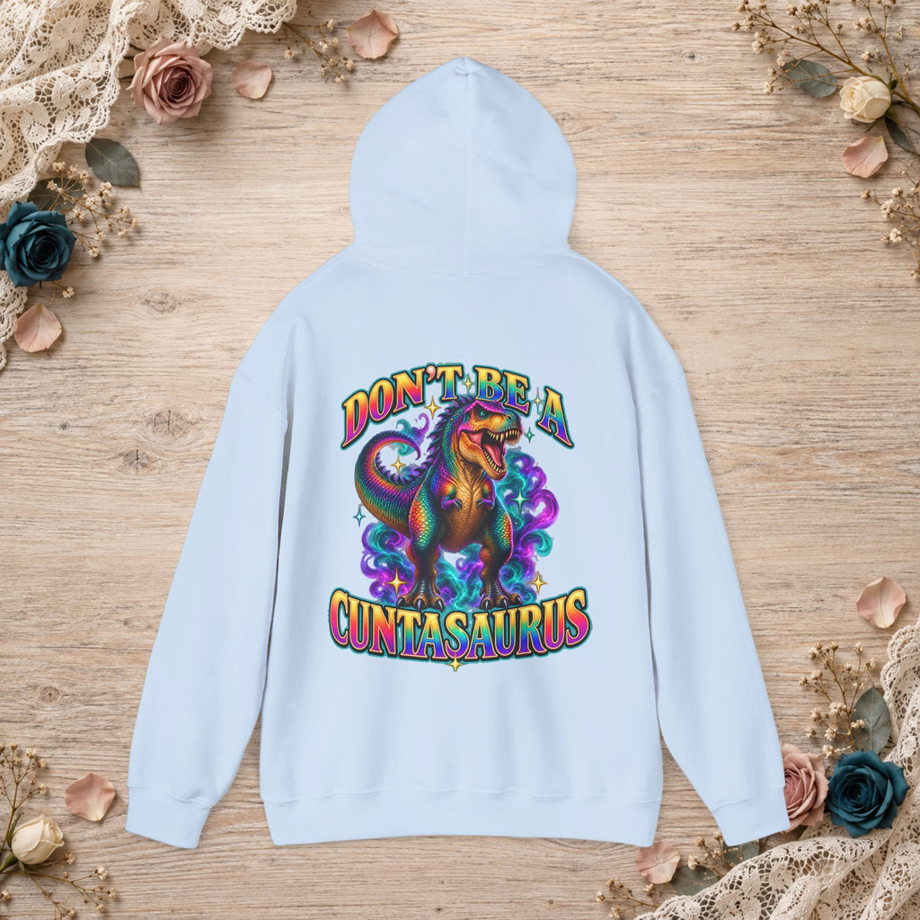 Light blue Don’t Be a Cuntasaurus hoodie with a large colorful dinosaur back design