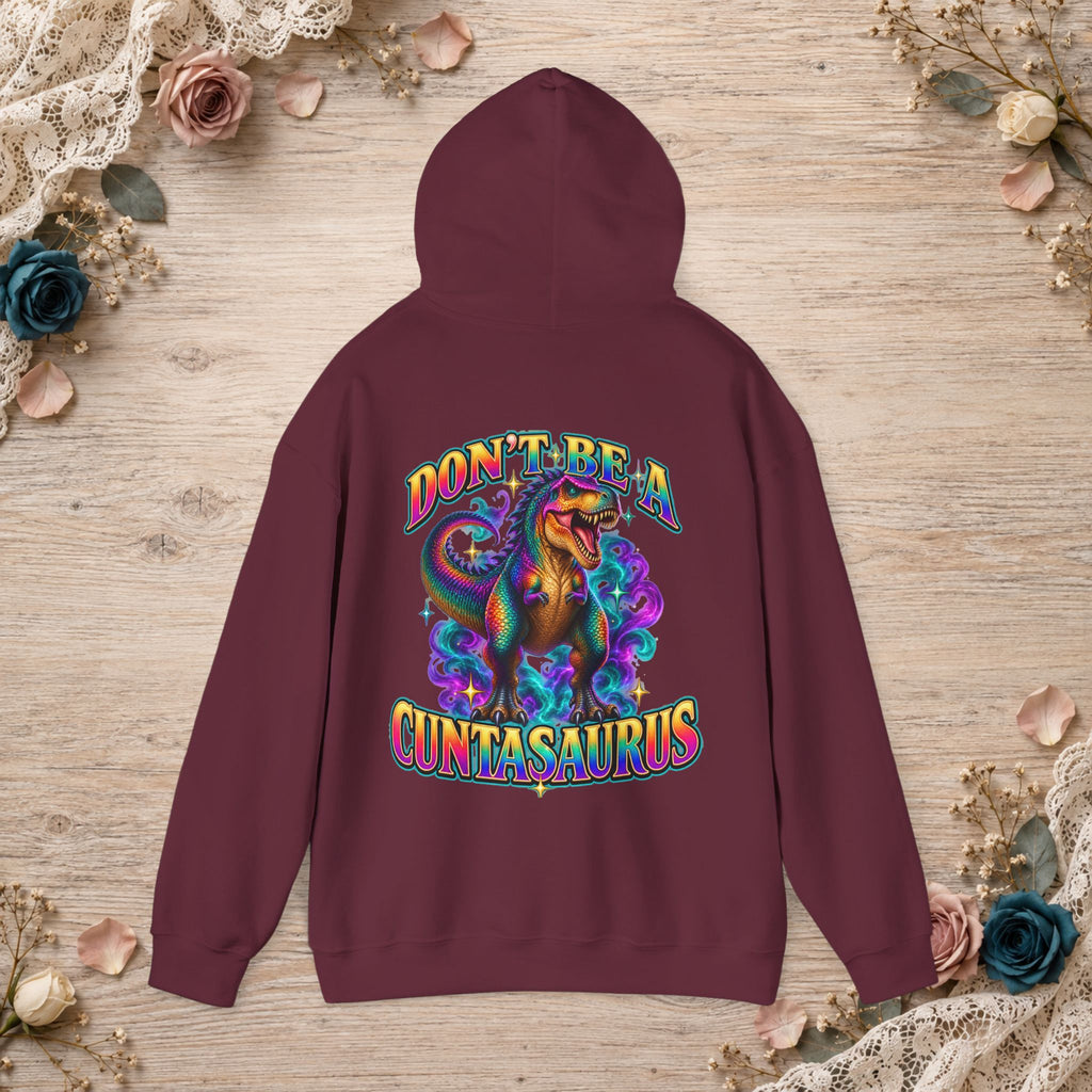 Maroon Don’t Be a Cuntasaurus hoodie featuring a large colorful T. rex back graphic