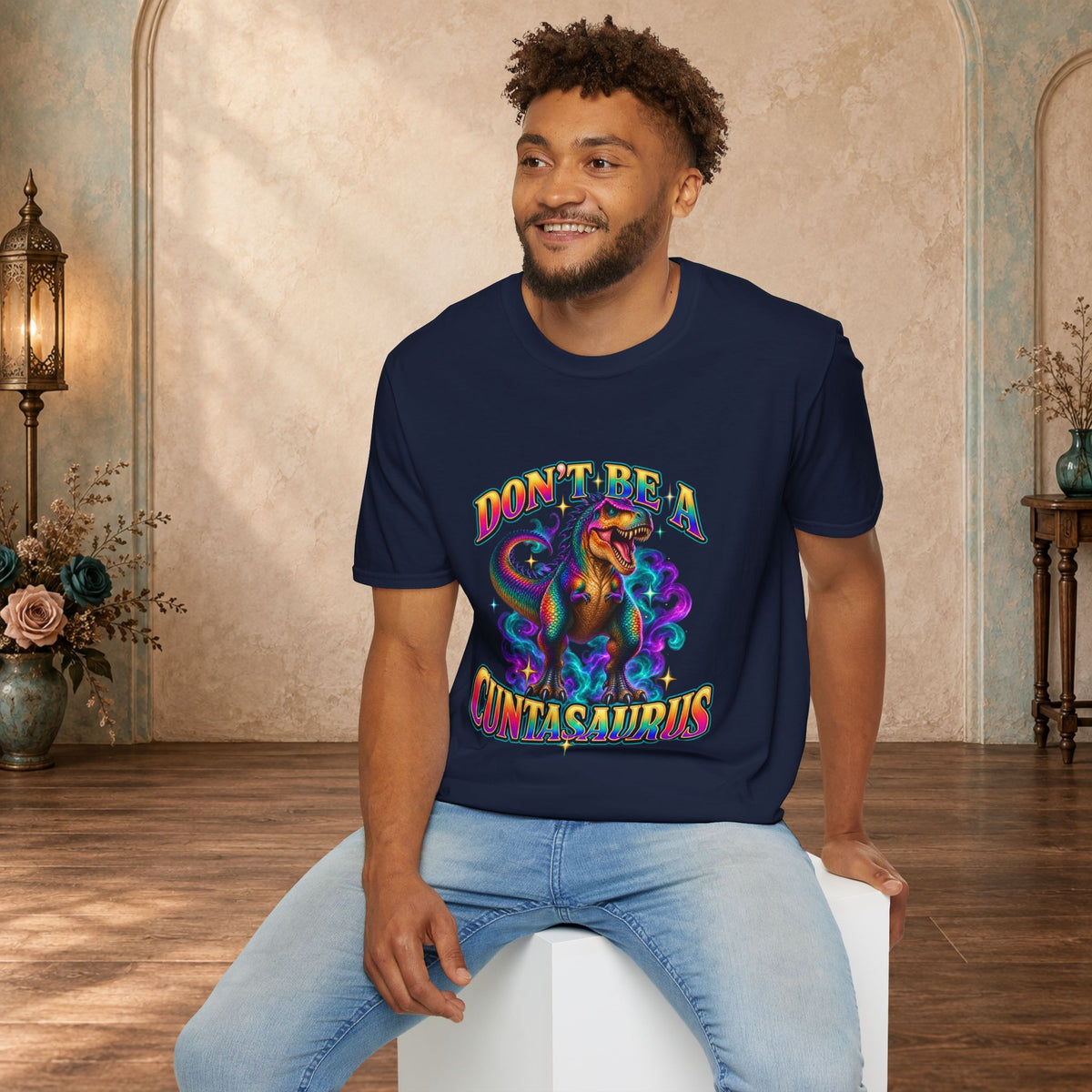 Man wearing a navy Don’t Be a Cuntasaurus adult humor dinosaur T-shirt