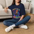 Woman wearing a navy Don’t Be a Cuntasaurus colorful dinosaur graphic T-shirt
