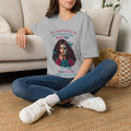 Seated woman wearing a Sport Grey Good Girl in Me sugar-skull T-shirt