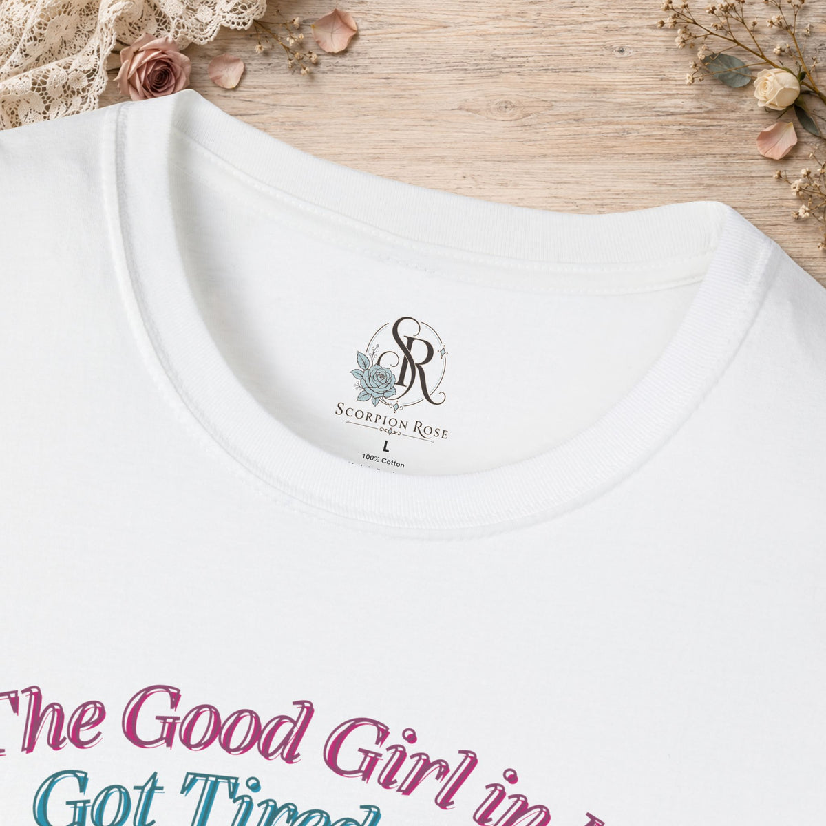 Close-up of the White Good Girl in Me T-shirt neckline and printed design