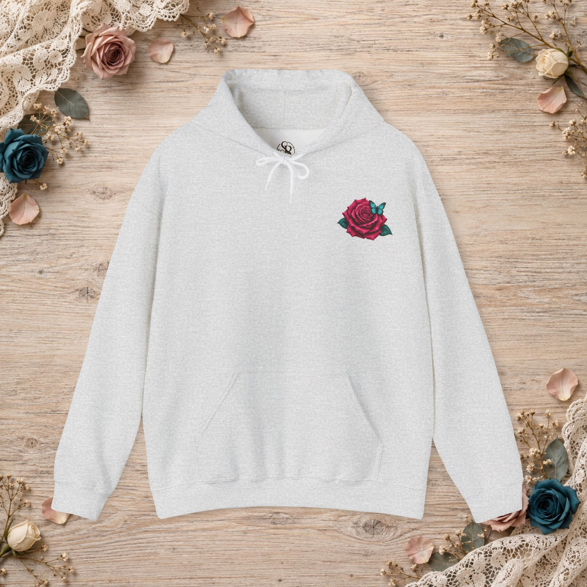 Front of ash hoodie with mauve rose and turquoise butterfly left-chest design
