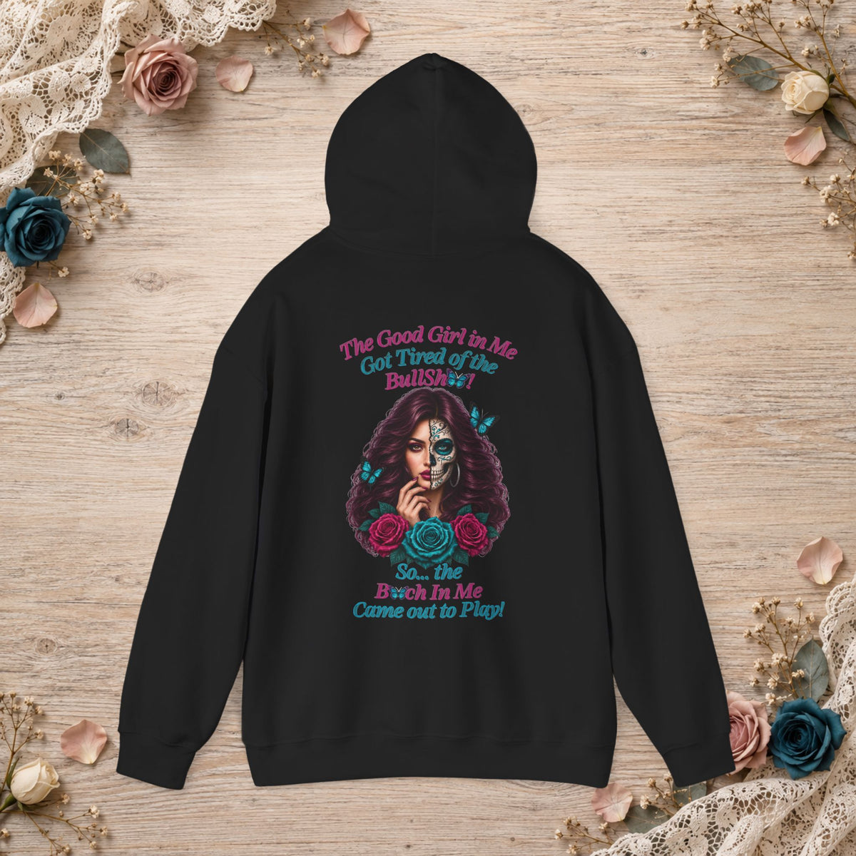 Back of black hoodie featuring the Good Girl sugar skull woman, roses, butterflies and statement quote