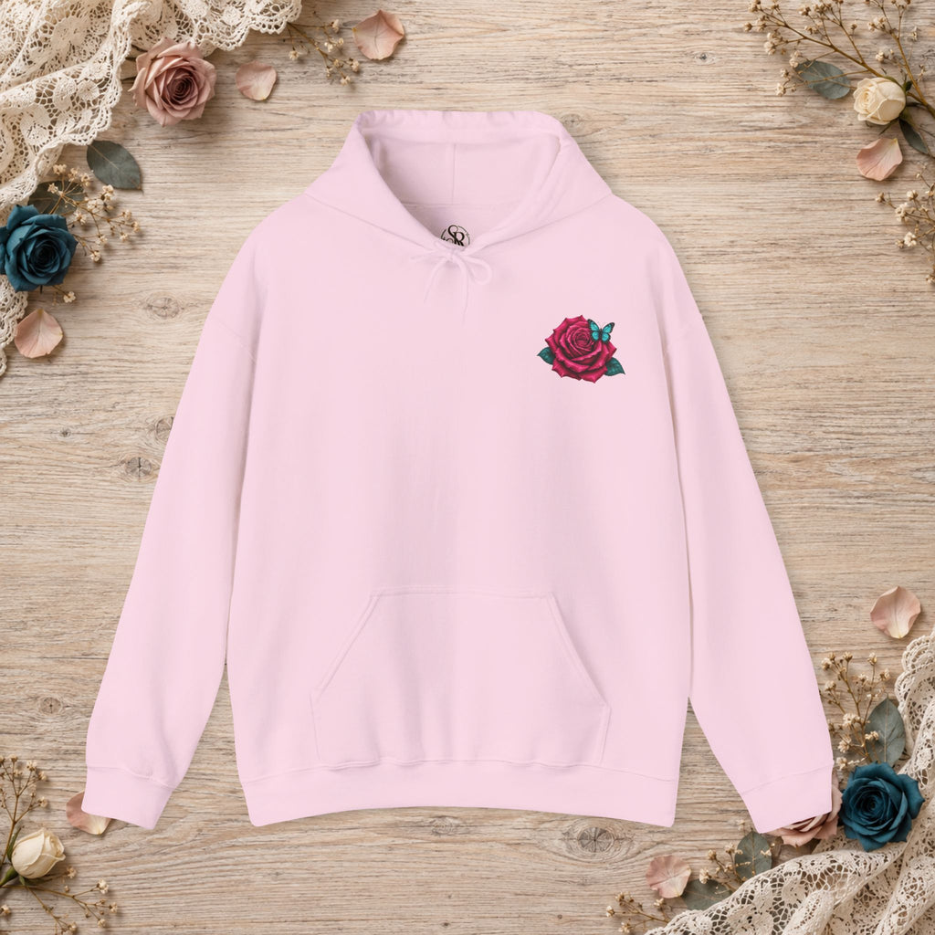 Front of light pink hoodie with mauve rose and turquoise butterfly left-chest design