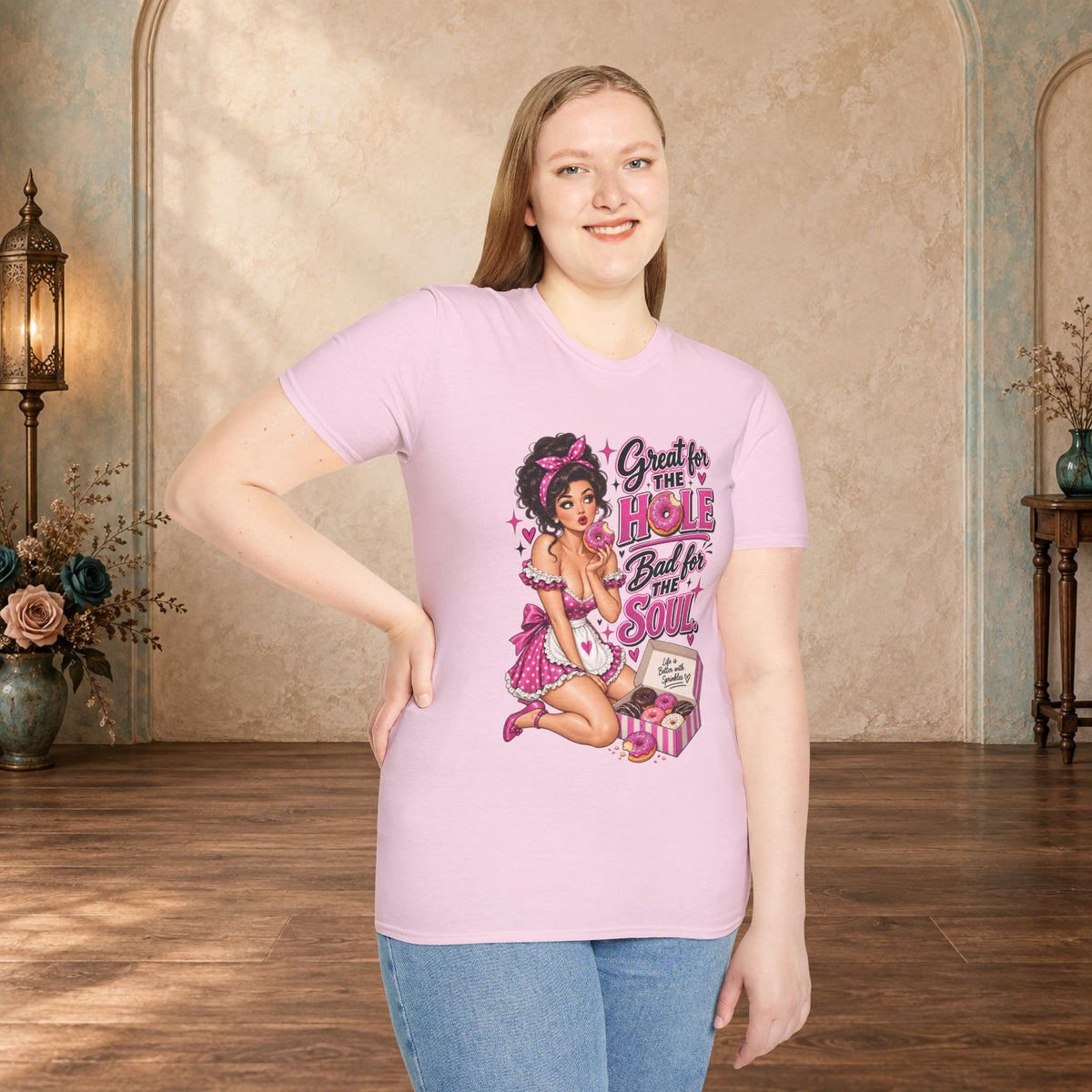 Woman modeling a light pink unisex T-shirt featuring the Great for the Hole, Bad for the Soul pin-up design.