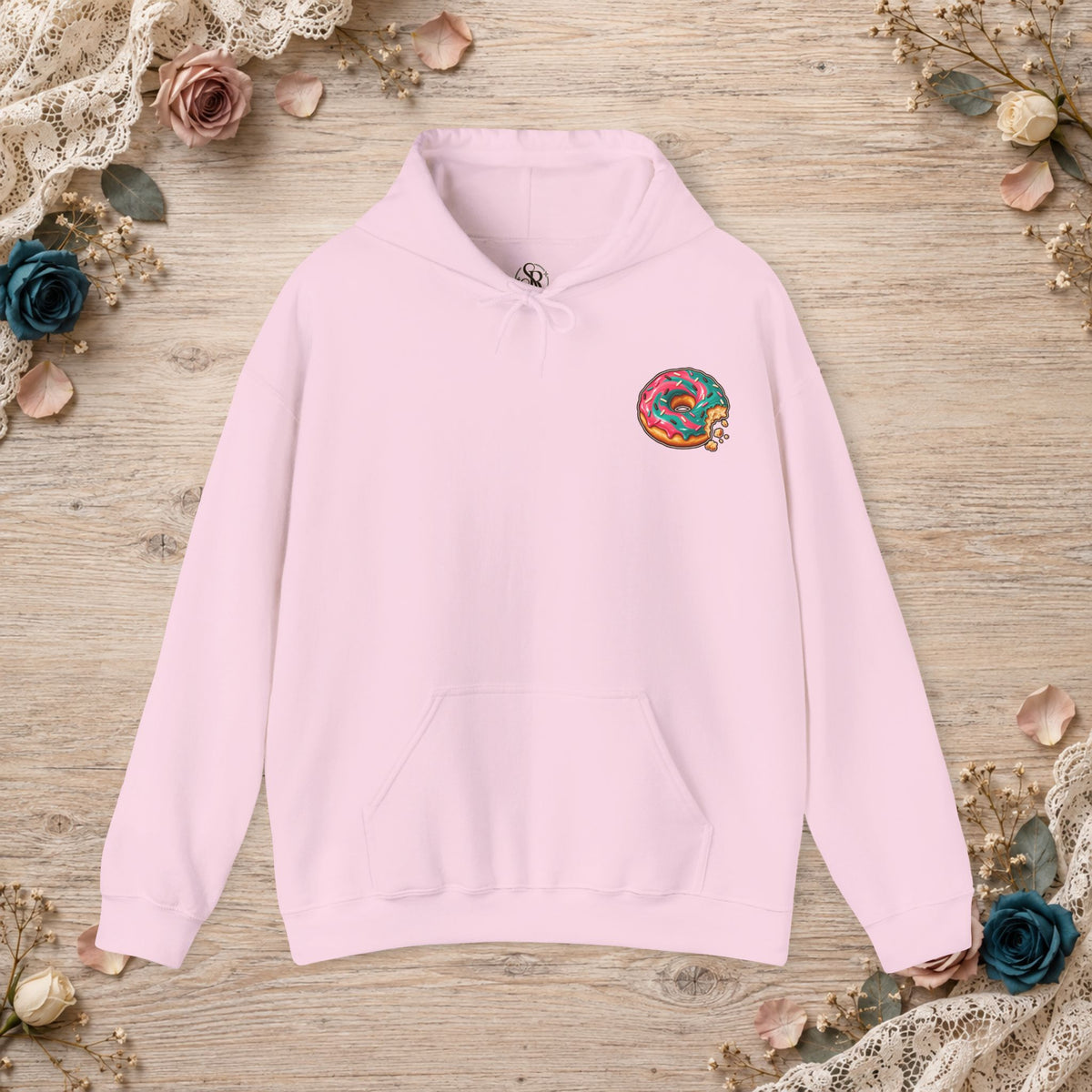 Light pink Great for the Hole, Bad for the Soul hoodie with small donut design on the front left chest