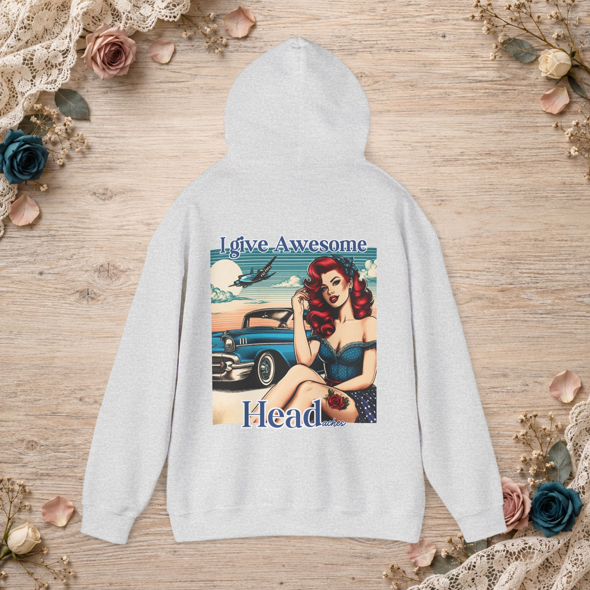 Ash unisex hoodie shown flat with I Give Awesome Headaches retro pin-up design printed on the back