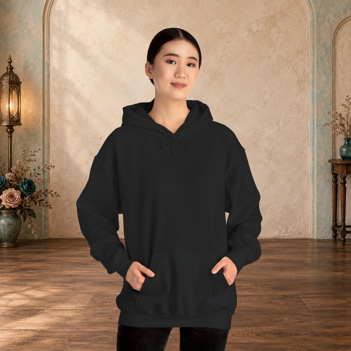 Female model wearing the blank front of a Black I Give Awesome Headaches unisex hoodie