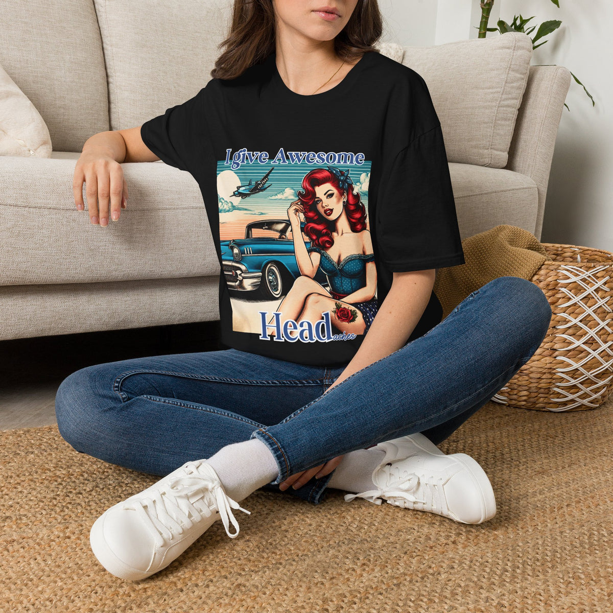 Woman wearing a black I Give Awesome Headaches funny pin-up graphic T-shirt