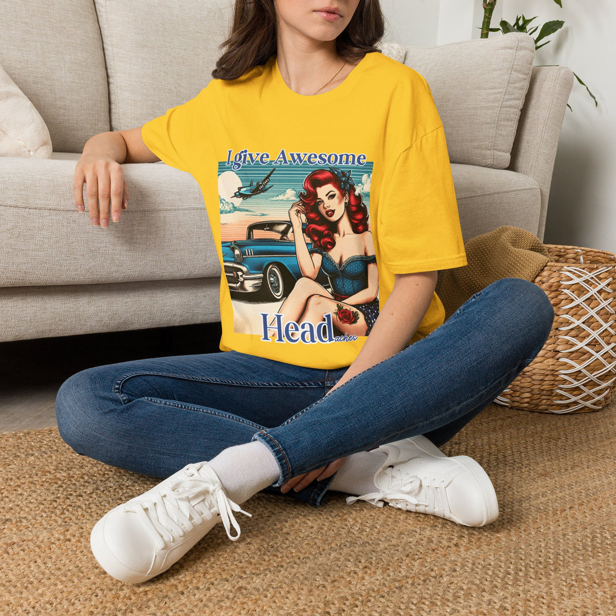 Woman wearing a Daisy yellow I Give Awesome Headaches funny graphic T-shirt