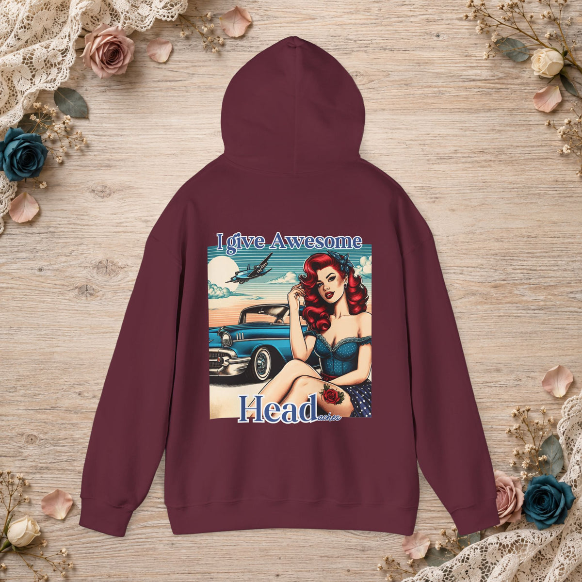 Maroon unisex hoodie shown flat with I Give Awesome Headaches vintage pin-up back graphic