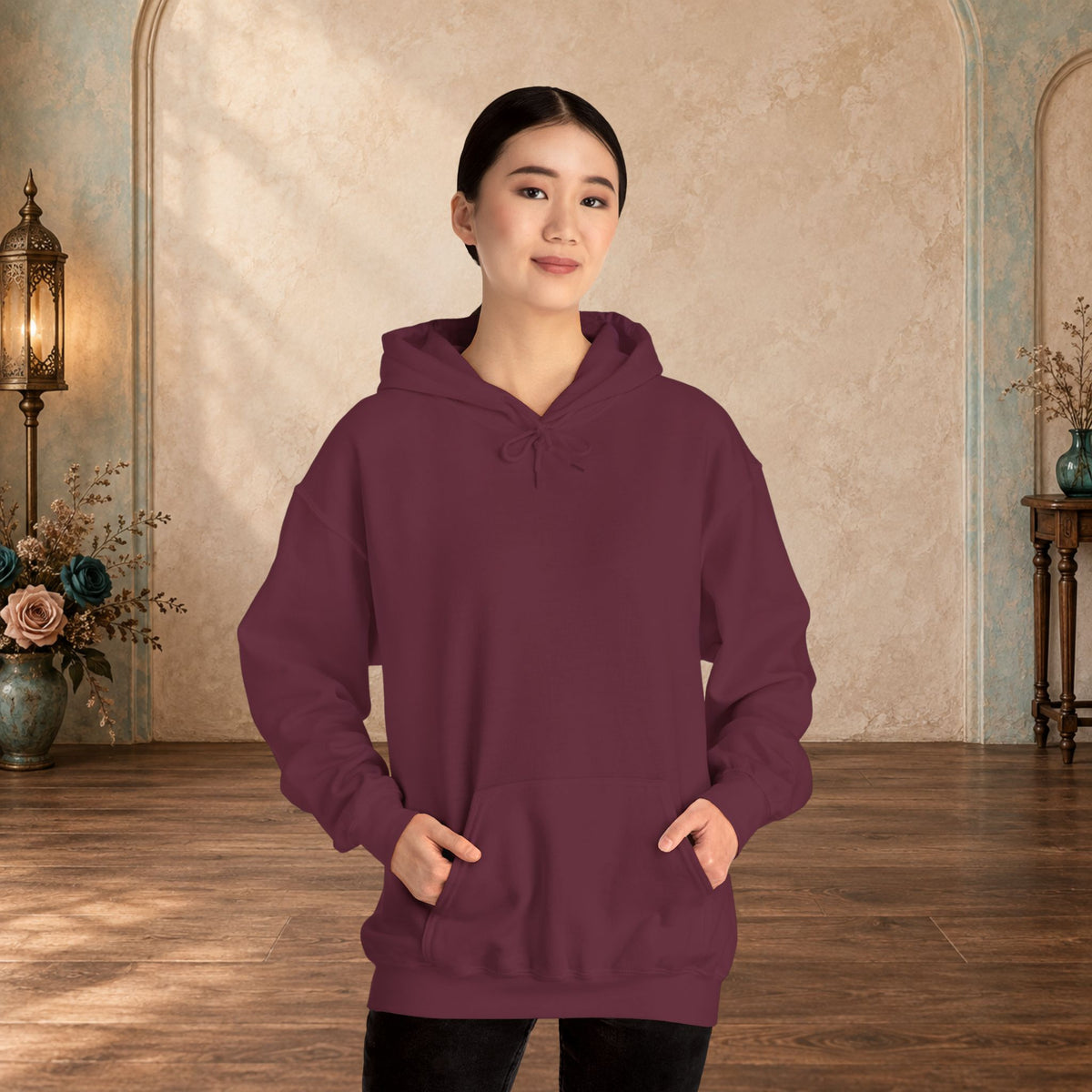 Female model wearing the blank front of a Maroon I Give Awesome Headaches unisex hoodie