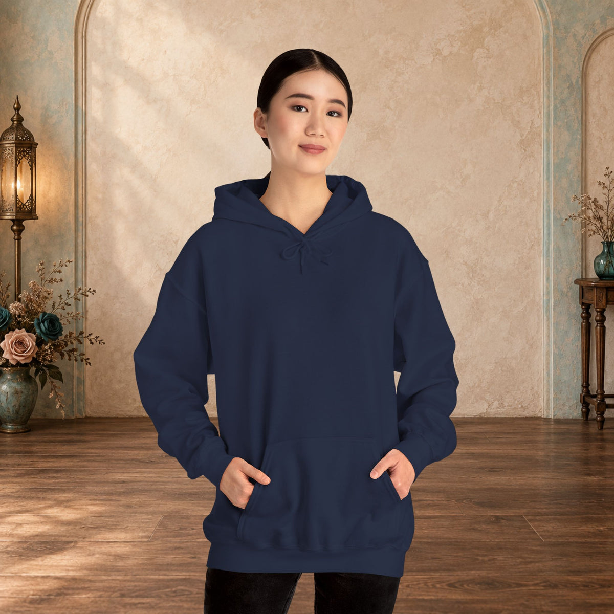 Female model wearing the blank front of a Navy I Give Awesome Headaches unisex hoodie