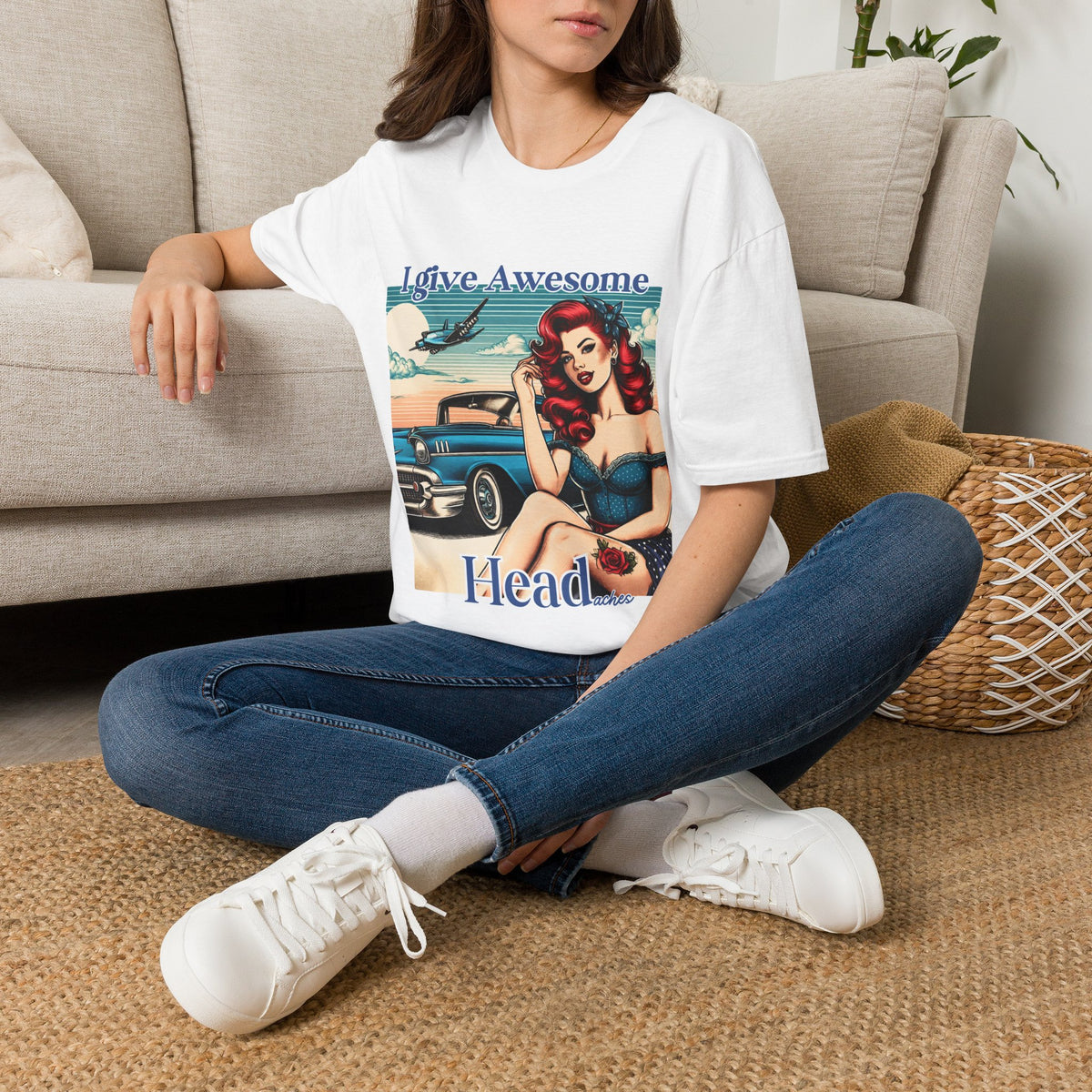 Woman wearing a white I Give Awesome Headaches adult-humor graphic tee