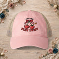 Dusty pink women’s mesh-back hat with an embroidered I’m the Plot Twist cherry bomb design.