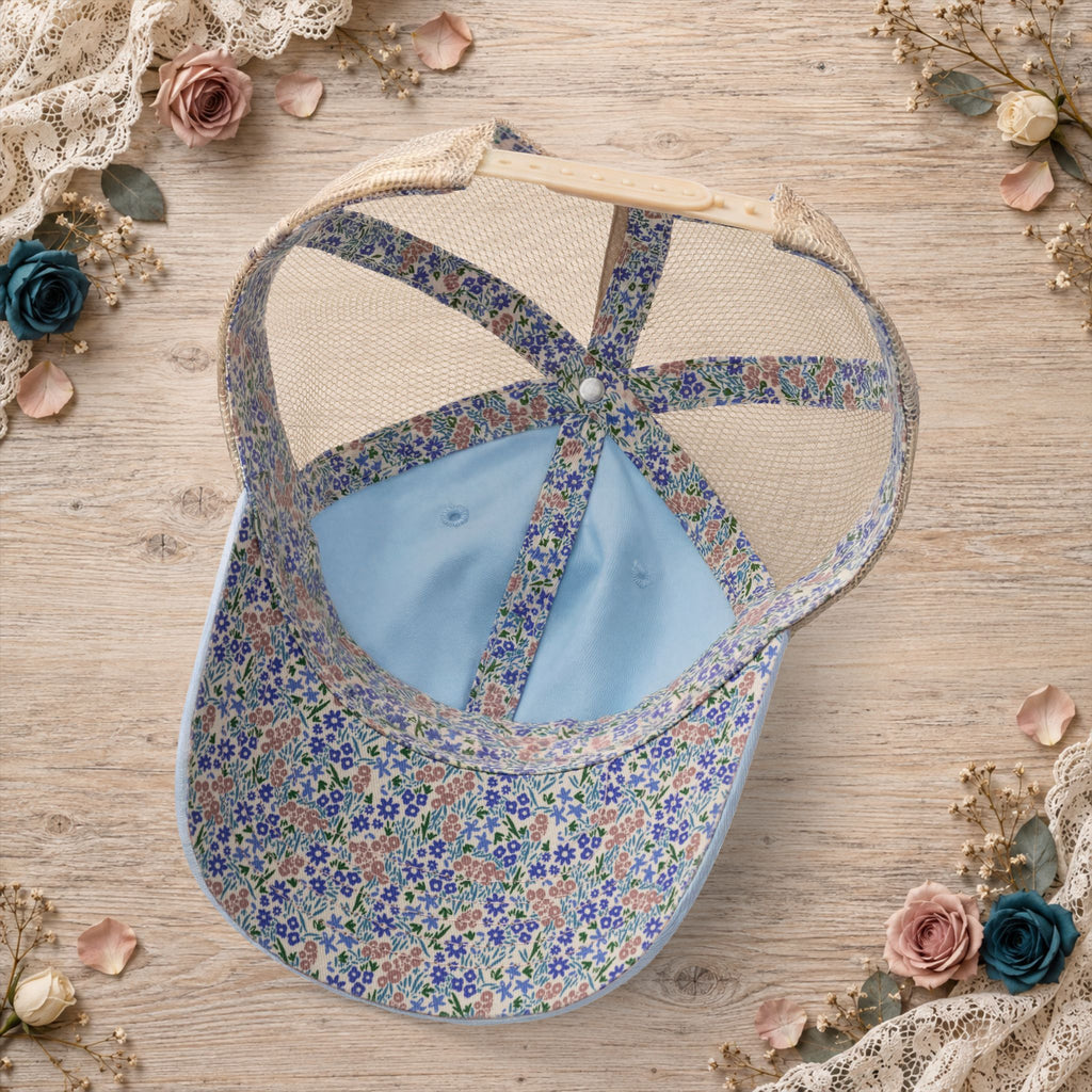 Back view of the cashmere blue hat featuring floral mesh