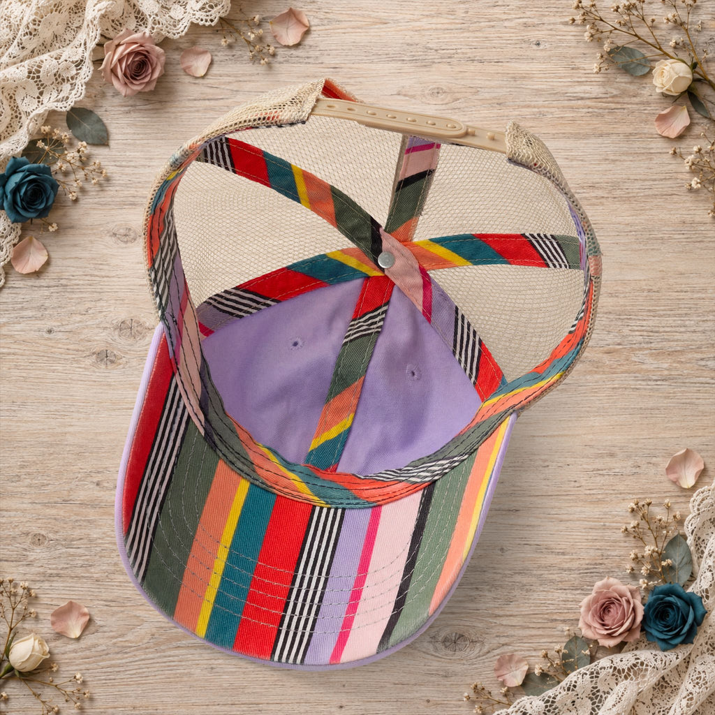 Back view of the lavender hat featuring colorful striped mesh.