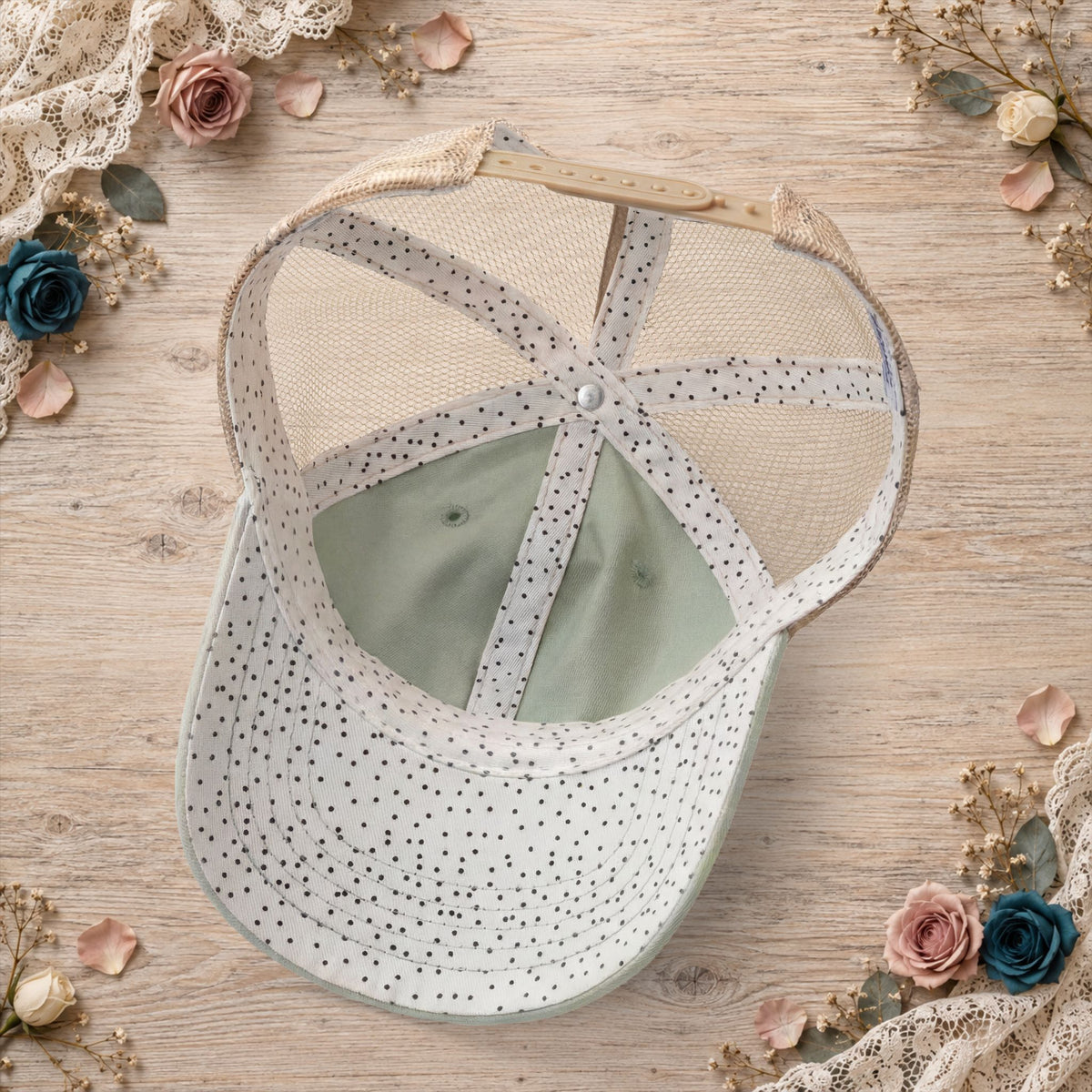 Back view of the sage hat featuring polka-dot mesh