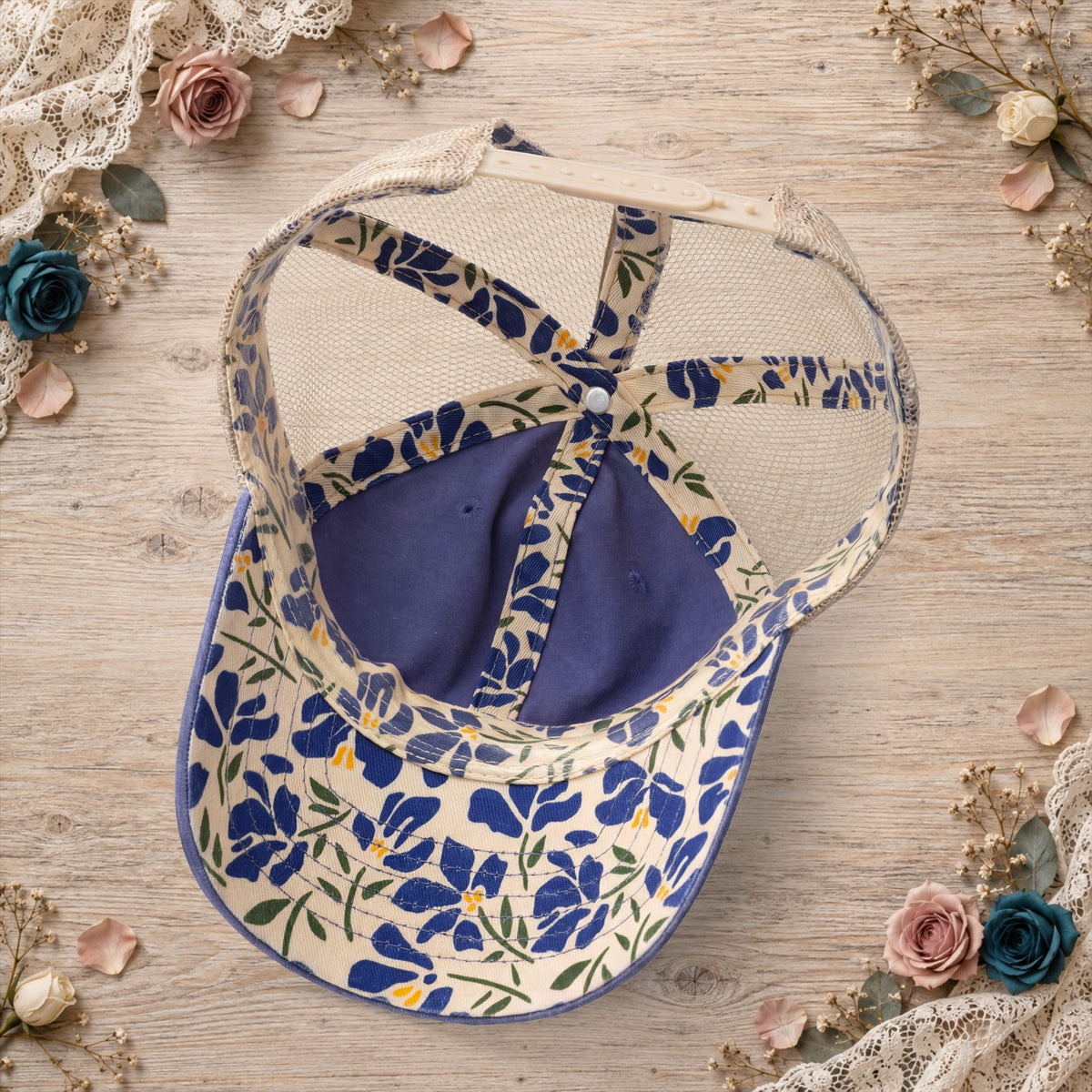 Back view of the violet hat featuring navy-and-khaki floral mesh 