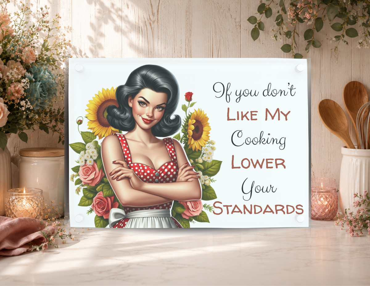 Lower Your Standards funny glass cutting board featuring a retro kitchen woman, sunflowers, roses, and a sarcastic cooking quote