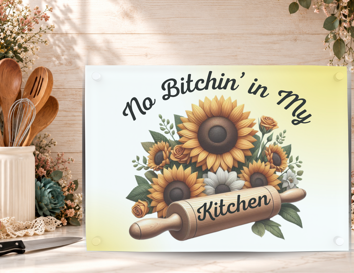 No Bitchin’ in My Kitchen tempered glass cutting board displayed with a kitchen knife, utensils, and floral accents