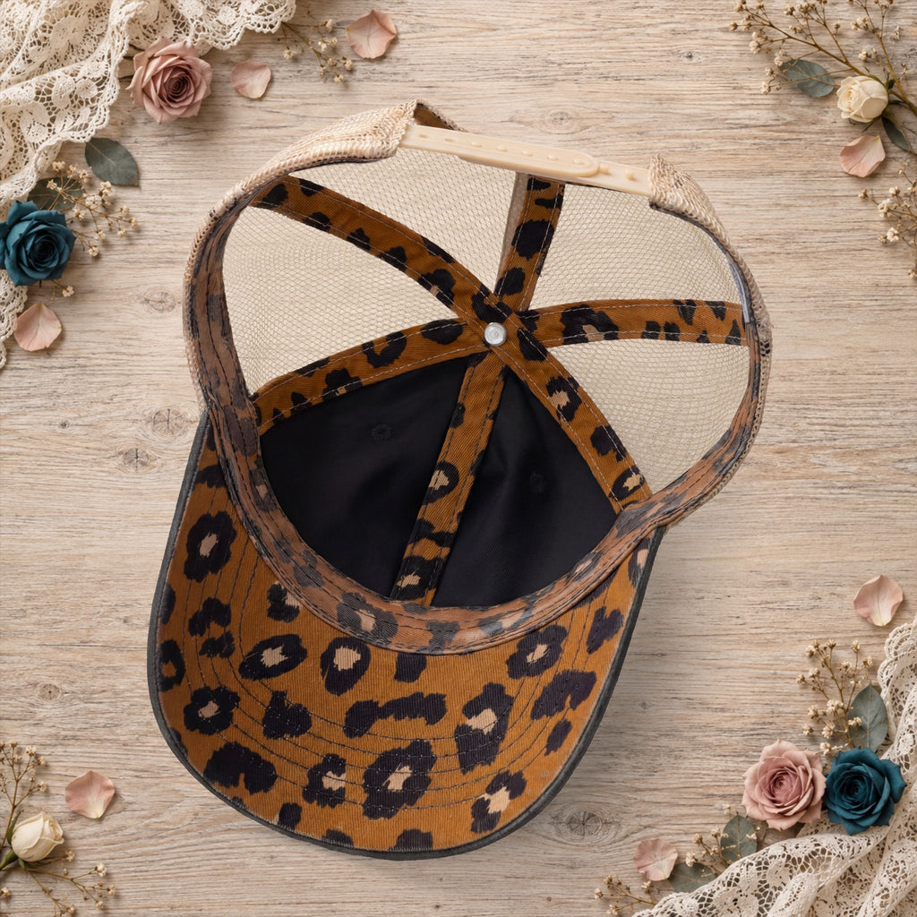Black ponytail trucker hat with leopard-print crisscross back