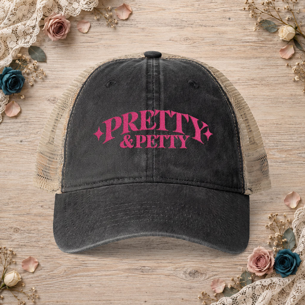 Black Pretty and Petty embroidered ponytail trucker hat front view