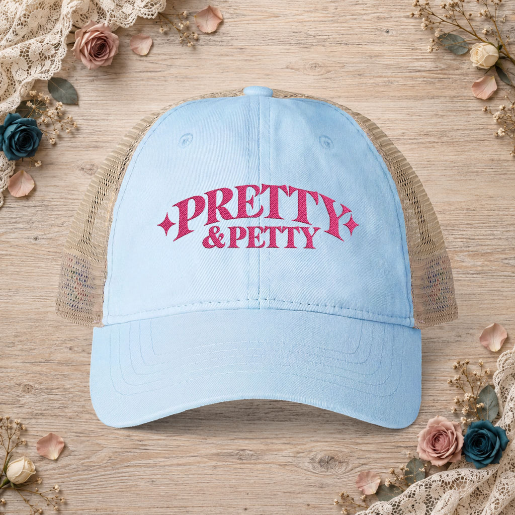 Cashmere blue Pretty and Petty embroidered ponytail trucker hat front view