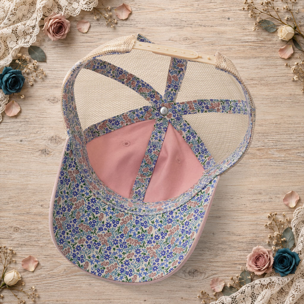 Dusty pink ponytail trucker hat with floral crisscross back