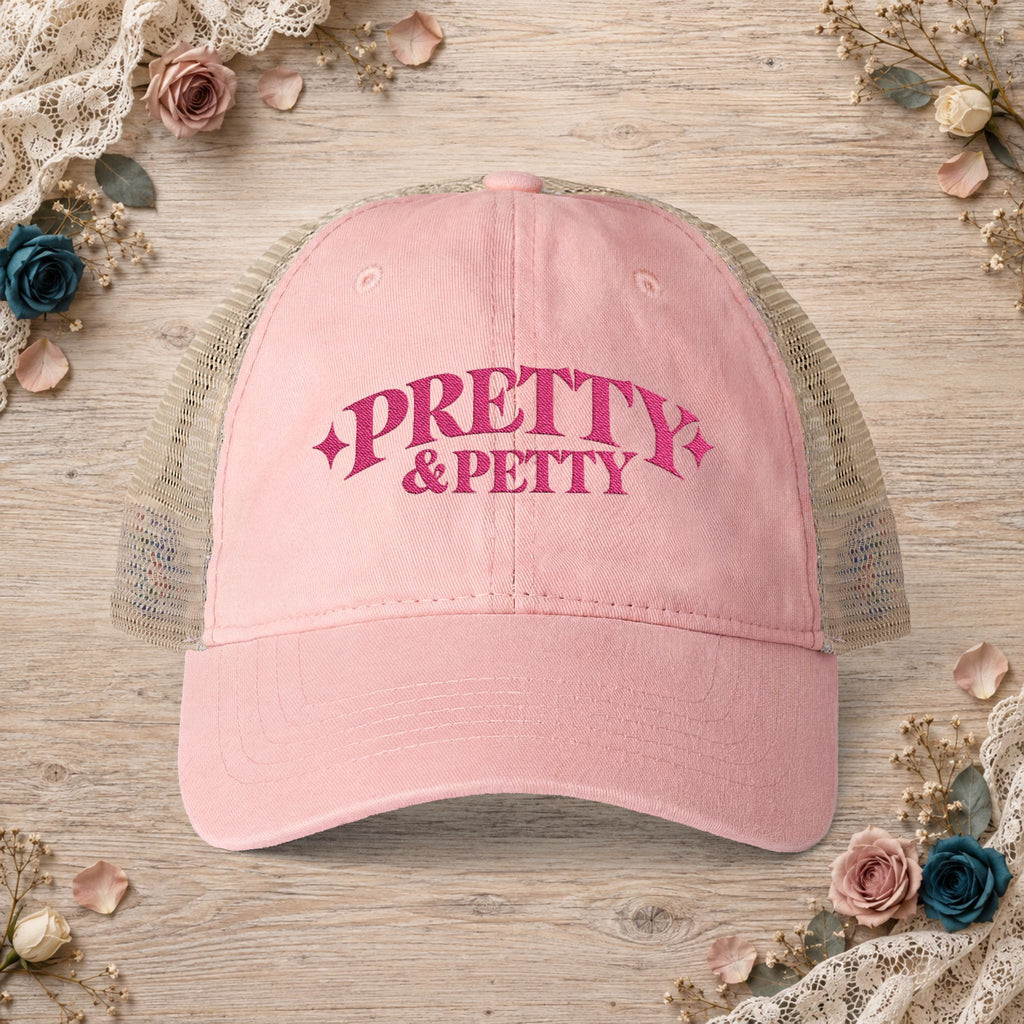 Dusty pink Pretty and Petty embroidered ponytail trucker hat front view