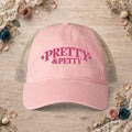 Dusty pink Pretty and Petty embroidered ponytail trucker hat front view