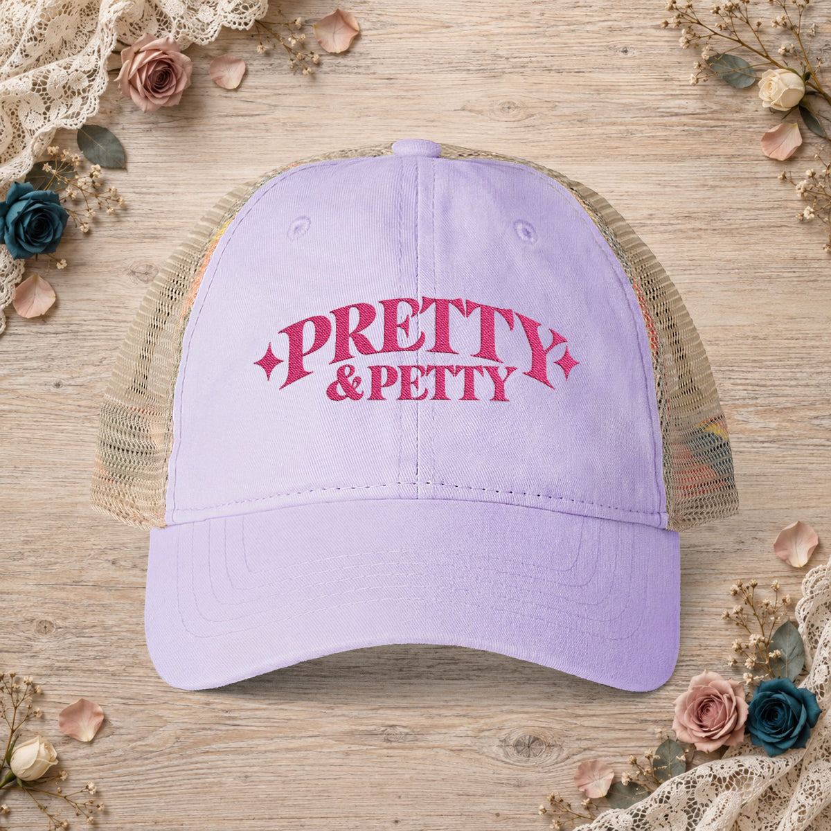 Lavender Pretty and Petty embroidered ponytail trucker hat front view