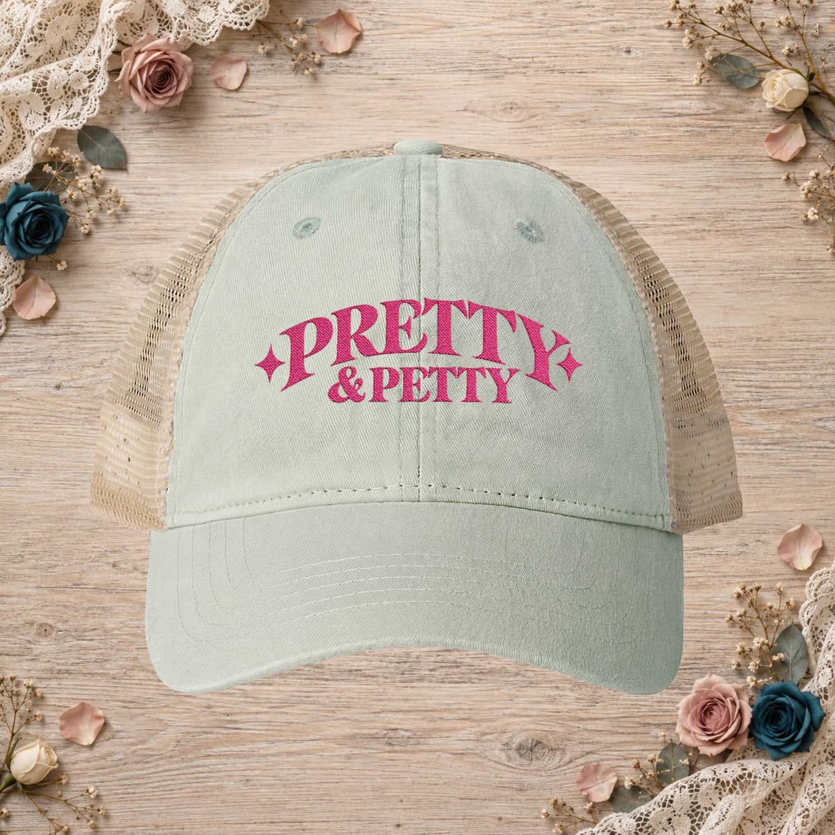 Sage Pretty and Petty embroidered ponytail trucker hat front view