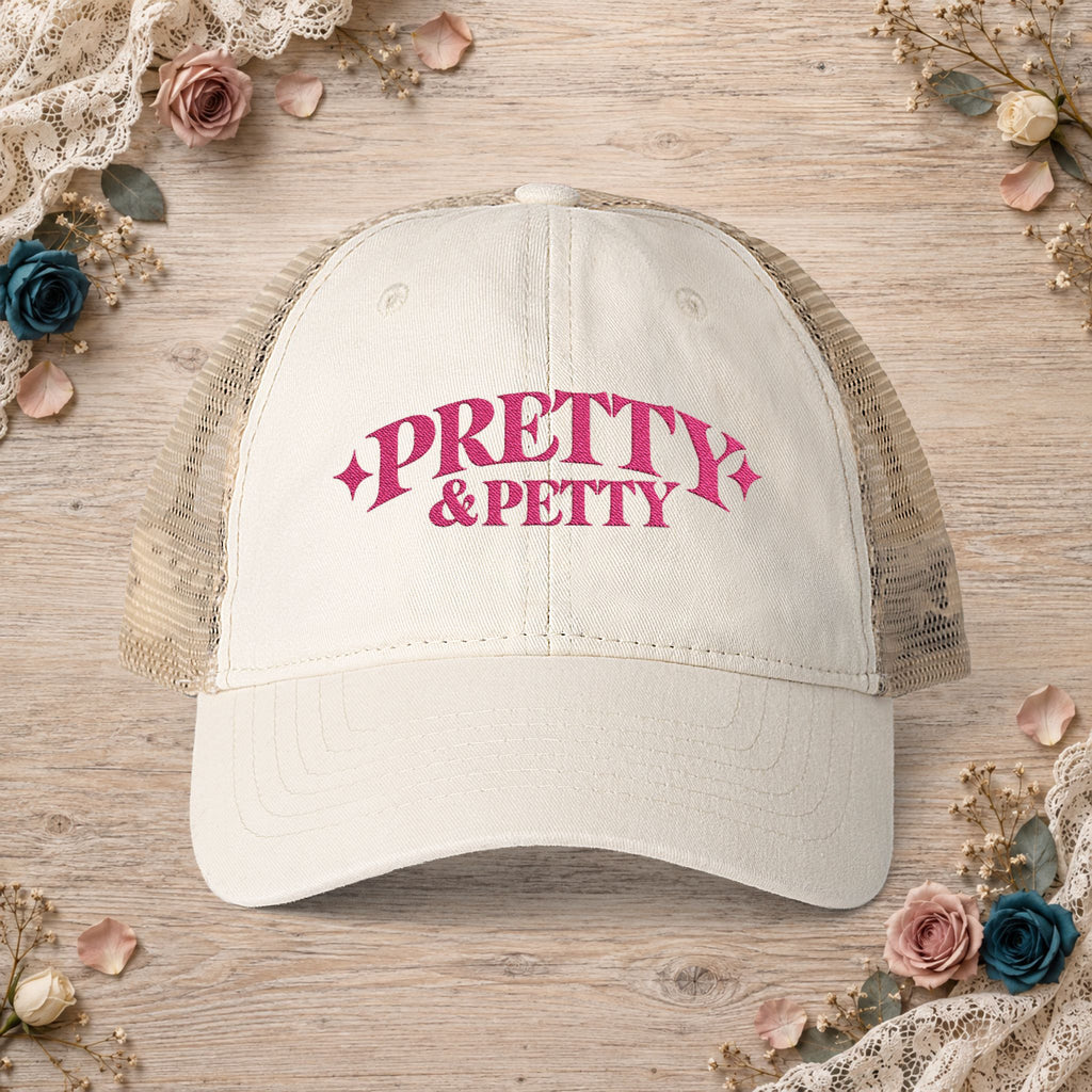 Vanilla Pretty and Petty embroidered ponytail trucker hat front view