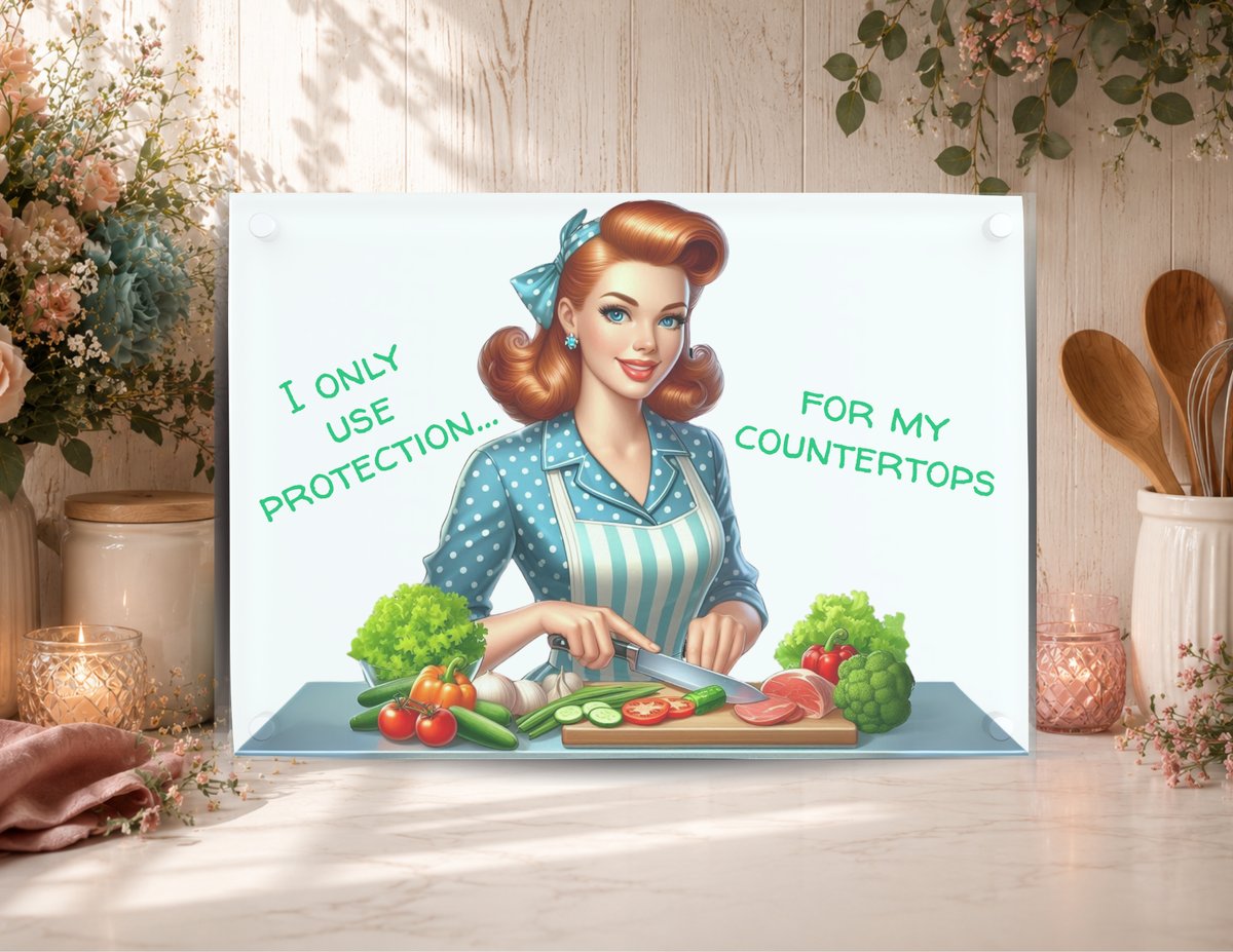 Funny glass cutting board featuring a retro kitchen woman and I Only Use Protection for My Countertops quote