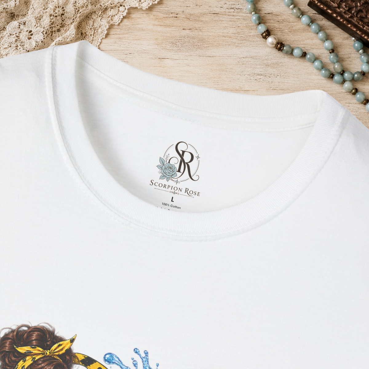 Scorpion Rose Designs custom inner neck label with size, fabric content, origin, and care symbols