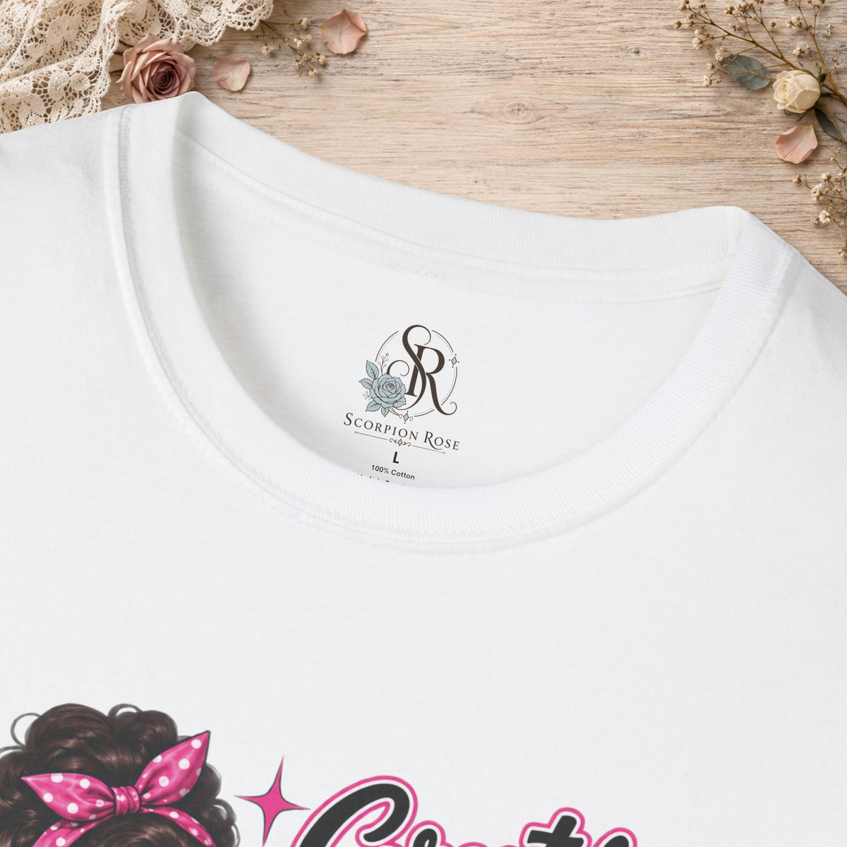 Close-up of the white T-shirt neckline showing the printed Scorpion Rose Designs inner neck label.